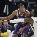 Phoenix Suns' TJ Warren is defended by Indiana Pacers' Victor Oladipo during the first half of an NBA basketball game Wednesday, Jan. 24, 2018, in Indianapolis. (AP Photo/Darron Cummings)