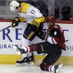 Nashville Predators left wing Scott Hartnell (17) and Arizona Coyotes defenseman Jakob Chychrun (6) compete for puck during the third period of an NHL hockey game Thursday, Jan. 4, 2018, in Glendale, Ariz. The Coyotes defeated the Predators 3-2. (AP Photo/Rick Scuteri)