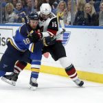 St. Louis Blues' Kyle Brodziak (28) and Arizona Coyotes' Brad Richardson (15) chase after a loose puck along the boards during the first period of an NHL hockey game Saturday, Jan. 20, 2018, in St. Louis. (AP Photo/Jeff Roberson)