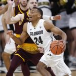 Colorado guard George King, front, drives past Arizona State guard Kodi Justice during the first half of an NCAA college basketball game Thursday, Jan. 4, 2018, in Boulder, Colo. (AP Photo/David Zalubowski)
