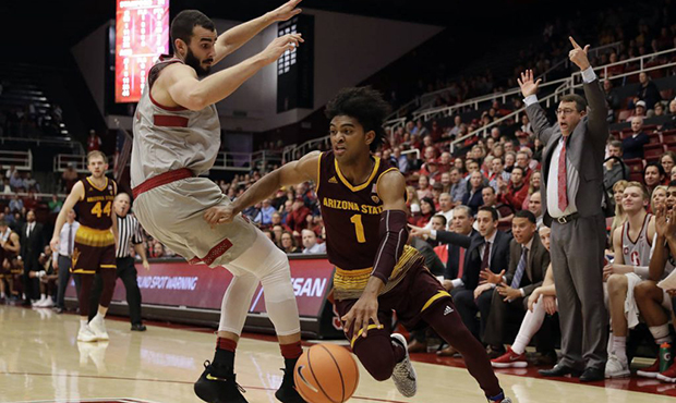 Arizona State guard Remy Martin (1) dribbles past Stanford center Josh Sharma, left, during the fir...