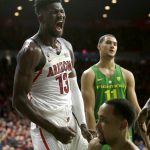 Arizona forward Deandre Ayton (13) reacts after getting fouled in the second half during an NCAA college basketball game against Oregon, Saturday, Jan. 13, 2018, in Tucson, Ariz. (AP Photo/Rick Scuteri)