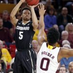 Colorado guard Deleon Brown (5) shoots over Arizona State guard Tra Holder (0) during the first half of an NCAA college basketball game, Saturday, Jan. 27, 2018, in Tempe, Ariz. (AP Photo/Matt York)