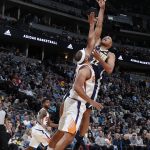 Phoenix Suns forward Jared Dudley, left, blocks a shot by Denver Nuggets forward Richard Jefferson in the first half of an NBA basketball game Friday, Jan. 19, 2018, in Denver. (AP Photo/David Zalubowski)