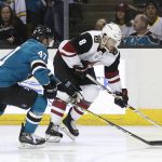 Arizona Coyotes right wing Tobias Rieder (8), from Germany, moves the puck up the ice past San Jose Sharks defenseman Joakim Ryan (47) during the second period of an NHL hockey game Saturday, Jan. 13, 2018, in San Jose, Calif. (AP Photo/Tony Avelar)