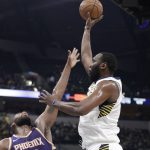 Indiana Pacers' Al Jefferson shoots over Phoenix Suns' Greg Monroe during the first half of an NBA basketball game Wednesday, Jan. 24, 2018, in Indianapolis. (AP Photo/Darron Cummings)