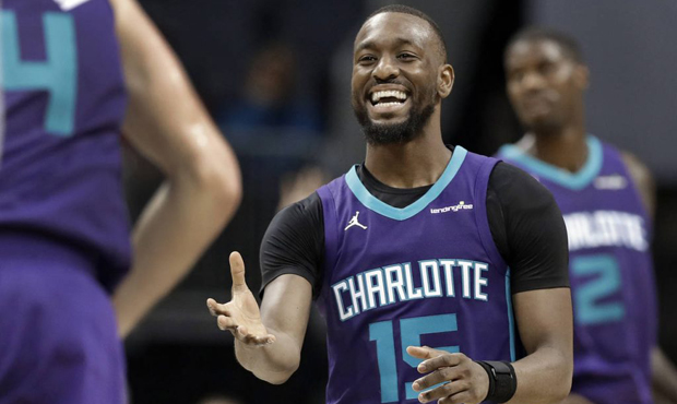 Charlotte Hornets' Kemba Walker (15) smiles after a basket against the Utah Jazz during the second ...