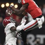 Georgia wide receiver Javon Wims (6) bobbles a ball which is intercepted by Alabama defensive back Tony Brown (2) in the NCAA college football playoff championship game in Atlanta on Monday, Jan. 8, 2018. (AJ Reynolds/Athens Banner-Herald via AP)