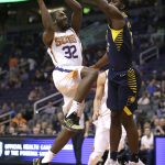 Phoenix Suns guard Davon Reed (32) drives on Indiana Pacers forward Alex Poythress in the second half during an NBA basketball game, Sunday, Jan. 14, 2018, in Phoenix. The Pacers defeated the Suns 120-97. (AP Photo/Rick Scuteri)