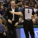 Phoenix Suns head coach Jay Triano, left, argues a call against referee Nick Buchert, right, as the Suns take on the Milwaukee Bucks during the first half of an NBA basketball game Monday, Jan. 22, 2018, in Milwaukee. (AP Photo/Darren Hauck)