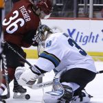 San Jose Sharks goaltender Aaron Dell (30) makes the save on Arizona Coyotes right wing Christian Fischer in the second period during an NHL hockey game, Tuesday, Jan. 16, 2018, in Glendale, Ariz. (AP Photo/Rick Scuteri)