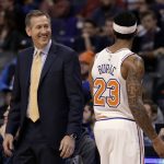 New York Knicks coach Jeff Hornacek has a laugh with Trey Burke (23) after the Knicks defeated the Phoenix Suns 107-85 during an NBA basketball game Friday, Jan. 26, 2018, in Phoenix. (AP Photo/Rick Scuteri)