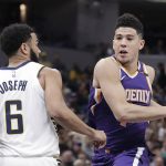 Phoenix Suns' Devin Booker goes to the basket against Indiana Pacers' Cory Joseph during the second half of an NBA basketball game Wednesday, Jan. 24, 2018, in Indianapolis. The Pacers won 116-101. (AP Photo/Darron Cummings)