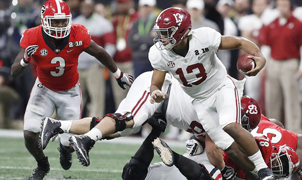 Alabama quarterback Tua Tagovailoa runs during the second half of the NCAA college football playoff...