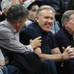 
              Denver Broncos general manager John Elway sits in a courtside seat to watch the Denver Nuggets host the Phoenix Suns in the first half of an NBA basketball game Wednesday, Jan. 3, 2018, in Denver. (AP Photo/David Zalubowski)
            