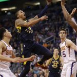 Indiana Pacers guard Joe Young (3) drives against Phoenix Suns guard Devin Booker and Dragan Bender (35) in the first half during an NBA basketball game, Sunday, Jan. 14, 2018, in Phoenix. (AP Photo/Rick Scuteri)