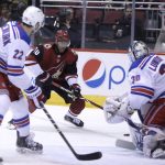 Arizona Coyotes left wing Anthony Duclair (10) drives against New York Rangers goaltender Henrik Lundqvist (30) in the second period during an NHL hockey game, Saturday, Jan. 6, 2018, in Glendale, Ariz. (AP Photo/Rick Scuteri)