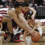 Washington State forward Arinze Chidom, left, and guard Malachi Flynn, right, go after the ball against Arizona guard Alex Barcello during the second half of an NCAA college basketball game in Pullman, Wash., Wednesday, Jan. 31, 2018. Arizona won 100-72. (AP Photo/Young Kwak)