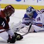 New York Rangers goaltender Henrik Lundqvist (30) covers the puck in front of Arizona Coyotes center Brad Richardson in the second period during an NHL hockey game, Saturday, Jan. 6, 2018, in Glendale, Ariz. (AP Photo/Rick Scuteri)