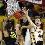 Oregon forward Paul White (13) slides past Arizona State guard Kodi Justice (44) to score during the second half of an NCAA college basketball game Thursday, Jan. 11, 2018, in Tempe, Ariz. Oregon defeated Arizona State 76-72. (AP Photo/Ross D. Franklin)