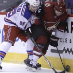 New York Rangers center Vinni Lettieri (95) and Arizona Coyotes defenseman Kevin Connauton battle for the puck in the first period during an NHL hockey game, Saturday, Jan. 6, 2018, in Glendale, Ariz. (AP Photo/Rick Scuteri)