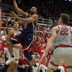 Arizona guard Parker Jackson-Cartwright (0) drives to the basket against Stanford forward Reid Travis (22) during the first half of an NCAA college basketball game Saturday, Jan. 20, 2018, in Stanford, Calif. (AP Photo/Tony Avelar)