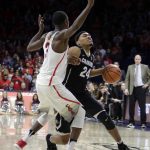 Colorado guard George King (24) gets fouled by Arizona guard Dylan Smith in the first half during an NCAA college basketball game, Thursday, Jan. 25, 2018, in Tucson, Ariz. (AP Photo/Rick Scuteri)