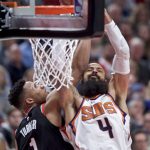 Phoenix Suns center Tyson Chandler, right, is fouled by Portland Trail Blazers guard Evan Turner during the second half of an NBA basketball game in Portland, Ore., Tuesday, Jan. 16, 2018. (AP Photo/Craig Mitchelldyer)