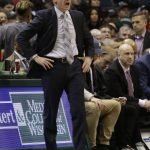 Milwaukee Bucks new interim manager Joe Prunty, left, calls to his team as they take on the Phoenix Suns during the first half of an NBA basketball game Monday, Jan. 22, 2018, in Milwaukee. (AP Photo/Darren Hauck)