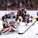 Columbus Blue Jackets goaltender Sergei Bobrovsky (72) makes a save on a shot by Arizona Coyotes defenseman Jakob Chychrun, right, during the second period of an NHL hockey game, Thursday, Jan. 25, 2018, in Glendale, Ariz. (AP Photo/Ross D. Franklin)