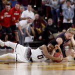 Arizona State guard Tra Holder (0) and Utah guard Parker Van Dyke (5) vie for a loose ball during the second half of an NCAA college basketball game Thursday, Jan. 25, 2018, in Tempe, Ariz. Utah won 80-77 in overtime. (AP Photo/Matt York)