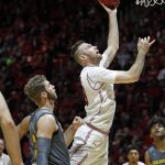 Utah forward David Collette (13) lays the ball up as Arizona State forward Mickey Mitchell (3) looks on in the second half of an NCAA college basketball game Sunday, Jan. 7, 2018, in Salt Lake City. (AP Photo/Rick Bowmer)
