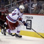 New York Rangers defenseman Ryan McDonagh (27) collects the puck in front of Arizona Coyotes center Brad Richardson in the second period during an NHL hockey game, Saturday, Jan. 6, 2018, in Glendale, Ariz. (AP Photo/Rick Scuteri)