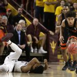 Oregon State guard Ethan Thompson (5) steals the ball from an injured Arizona State guard Tra Holder during the first half of an NCAA college basketball game Saturday, Jan. 13, 2018, in Tempe, Ariz. (AP Photo/Rick Scuteri)