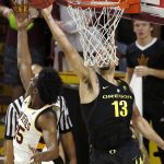 Oregon forward Paul White (13) gets off a shot over Arizona State forward De'Quon Lake, left, during the second half of an NCAA college basketball game Thursday, Jan. 11, 2018, in Tempe, Ariz. Oregon defeated Arizona State 76-72. (AP Photo/Ross D. Franklin)