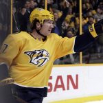Nashville Predators left wing Scott Hartnell celebrates after scoring a goal against the Arizona Coyotes during the second period of an NHL hockey game Thursday, Jan. 18, 2018, in Nashville, Tenn. (AP Photo/Mark Humphrey)