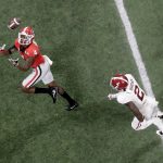 Georgia wide receiver Mecole Hardman prepares to catch the ball ahead Alabama defensive back Tony Brown for a touchdown catch during the second half of the NCAA college football playoff championship game Monday, Jan. 8, 2018, in Atlanta. (AP Photo/John Bazemore)