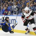 Arizona Coyotes center Zac Rinaldo, right, knocks down St. Louis Blues right wing Chris Thorburn in the second period of an NHL hockey game Saturday, Jan. 20, 2018, in St. Louis. (Chris Lee/St. Louis Post-Dispatch via AP)