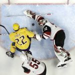Arizona Coyotes goaltender Antti Raanta (32), of Finland, blocks a shot as Nashville Predators left wing Kevin Fiala (22), of Switzerland, watches for a rebound durign the first period of an NHL hockey game Thursday, Jan. 18, 2018, in Nashville, Tenn. Also defending is Jason Demers (55). (AP Photo/Mark Humphrey)