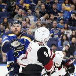 St. Louis Blues defenseman Alex Pietrangelo, left, competes for the puck against Arizona Coyotes center Clayton Keller in the first period of an NHL hockey game Saturday, Jan. 20, 2018, in St. Louis. (Chris Lee/St. Louis Post-Dispatch via AP)