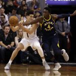Indiana Pacers guard Victor Oladipo (4) steals the ball on Phoenix Suns guard Devin Booker in the first half during an NBA basketball game, Sunday, Jan. 14, 2018, in Phoenix. (AP Photo/Rick Scuteri)