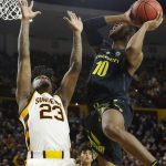 Oregon guard Victor Bailey Jr. (10) shoots over Arizona State forward Romello White (23) during the first half of an NCAA college basketball game, Thursday, Jan. 11, 2018, in Tempe, Ariz. (AP Photo/Ross D. Franklin)