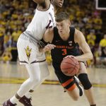 Oregon State forward Tres Tinkle (3) drives on Arizona State forward Kimani Lawrence during the first half of an NCAA college basketball game Saturday, Jan. 13, 2018, in Tempe, Ariz. (AP Photo/Rick Scuteri)