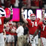 Georgia react after a replay confirmed a touchdown during the second half of the NCAA college football playoff championship game against Alabama Monday, Jan. 8, 2018, in Atlanta. (AP Photo/David Goldman)