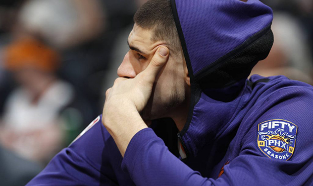 Phoenix Suns center Alex Len, of Ukraine, watches from the bench during the second half of the team...