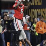 Georgia wide receiver Javon Wims catches a pass in front of Alabama's Anthony Averett during the first half of the NCAA college football playoff championship game Monday, Jan. 8, 2018, in Atlanta. (AP Photo/David J. Phillip)