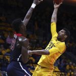 California's Marcus Lee, right, shoots over Arizona's Deandre Ayton (13) in the first half of an NCAA college basketball game Wednesday, Jan. 17, 2018, in Berkeley, Calif. (AP Photo/Ben Margot)