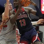 Arizona forward Deandre Ayton (13) drive to the basket against Stanford forward Michael Humphrey (10) during the first half of an NCAA college basketball game Saturday, Jan. 20, 2018, in Stanford, Calif. (AP Photo/Tony Avelar)