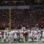 Fans hold up cell phones with lights during the second half of the NCAA college football playoff championship game between Georgia and Alabama Monday, Jan. 8, 2018, in Atlanta. (AP Photo/David Goldman)