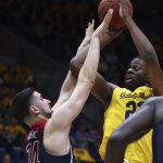 California's Kingsley Okoroh, right, shoots over Arizona's Dusan Ristic (14) in the first half of an NCAA college basketball game Wednesday, Jan. 17, 2018, in Berkeley, Calif. (AP Photo/Ben Margot)